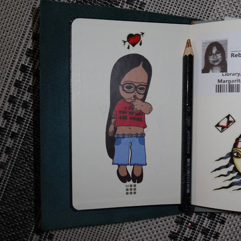 Card with a cartoon character on a textured surface
